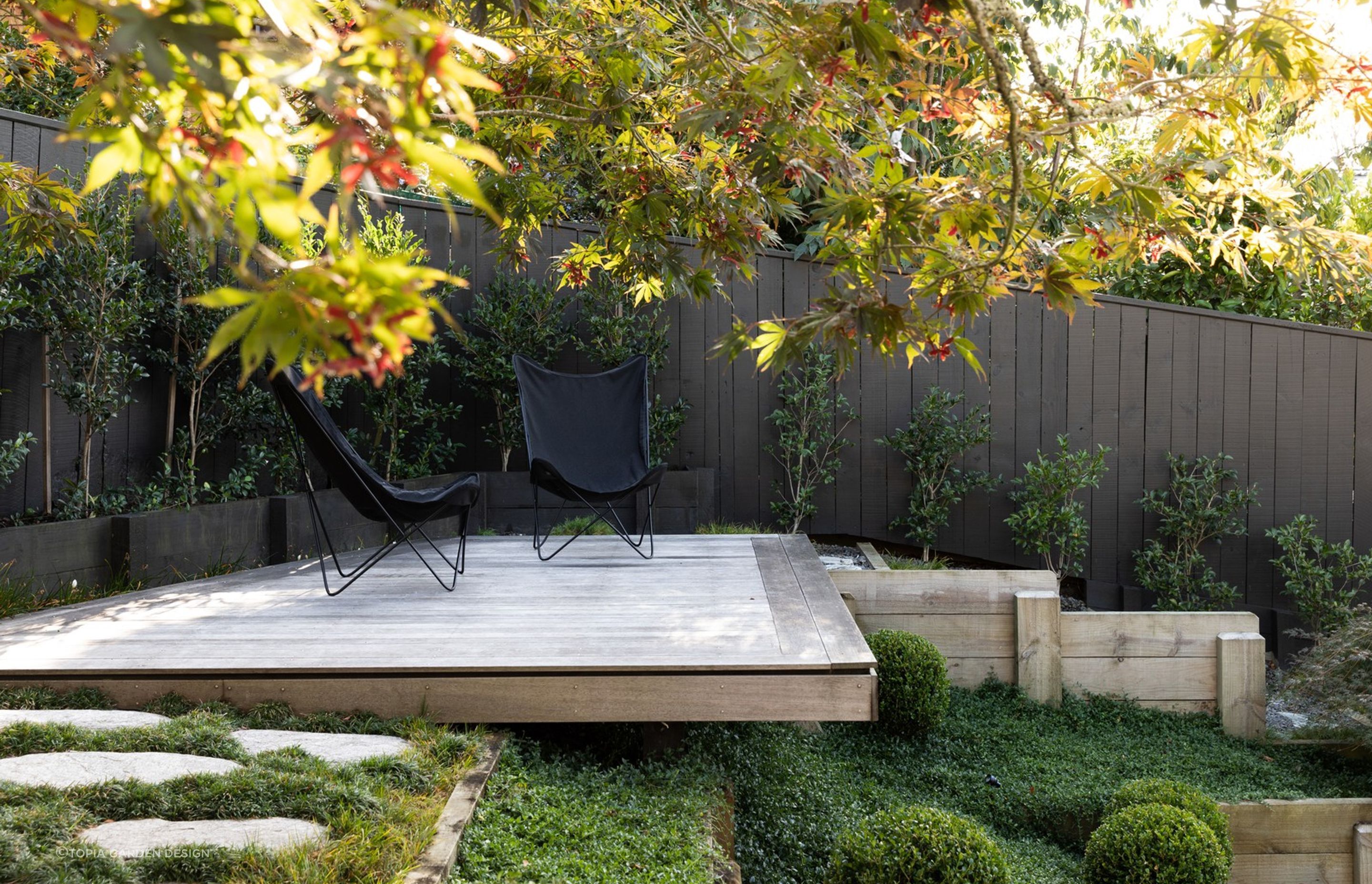 Hardscaping can be used to create sanctuaries of solitude, like this delightful space here in Crocus Place.