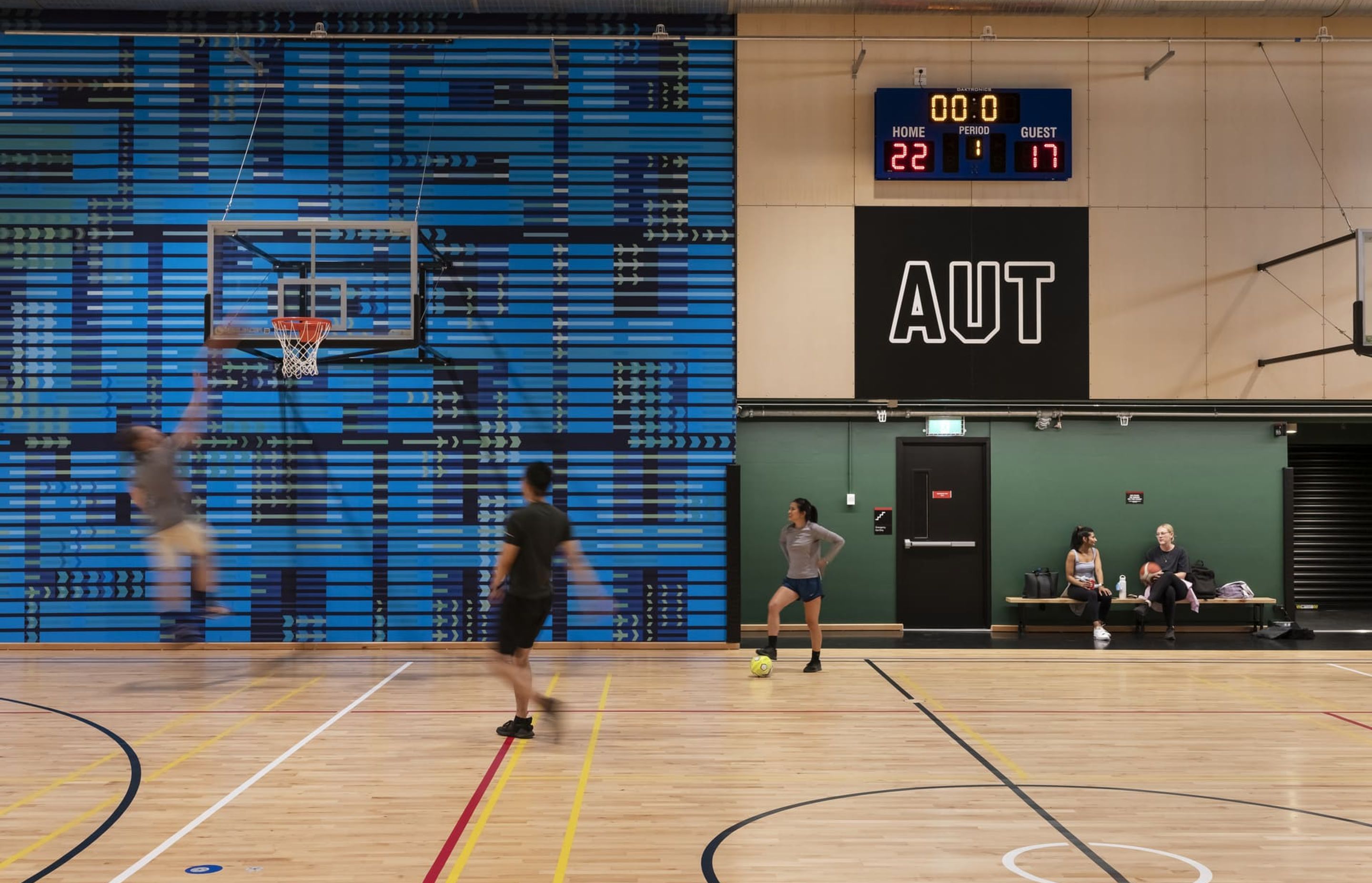 A series of solid and perforated fire-rated MDF panels – to meet acoustic, fire and impact resistance criteria for the gym – were specified and finished with the native timber.