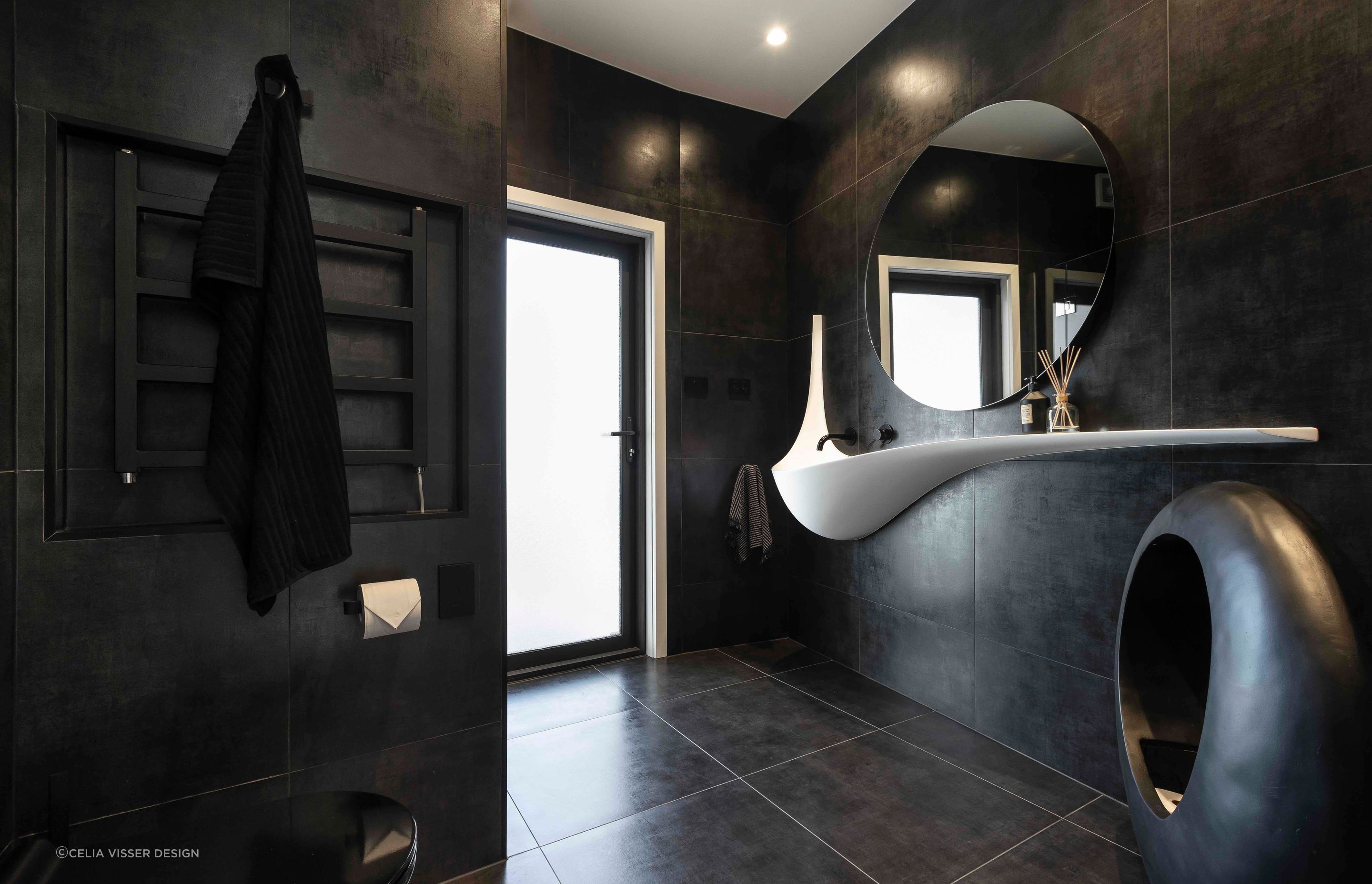 Black, bold and brilliant — the Wiri bathroom.