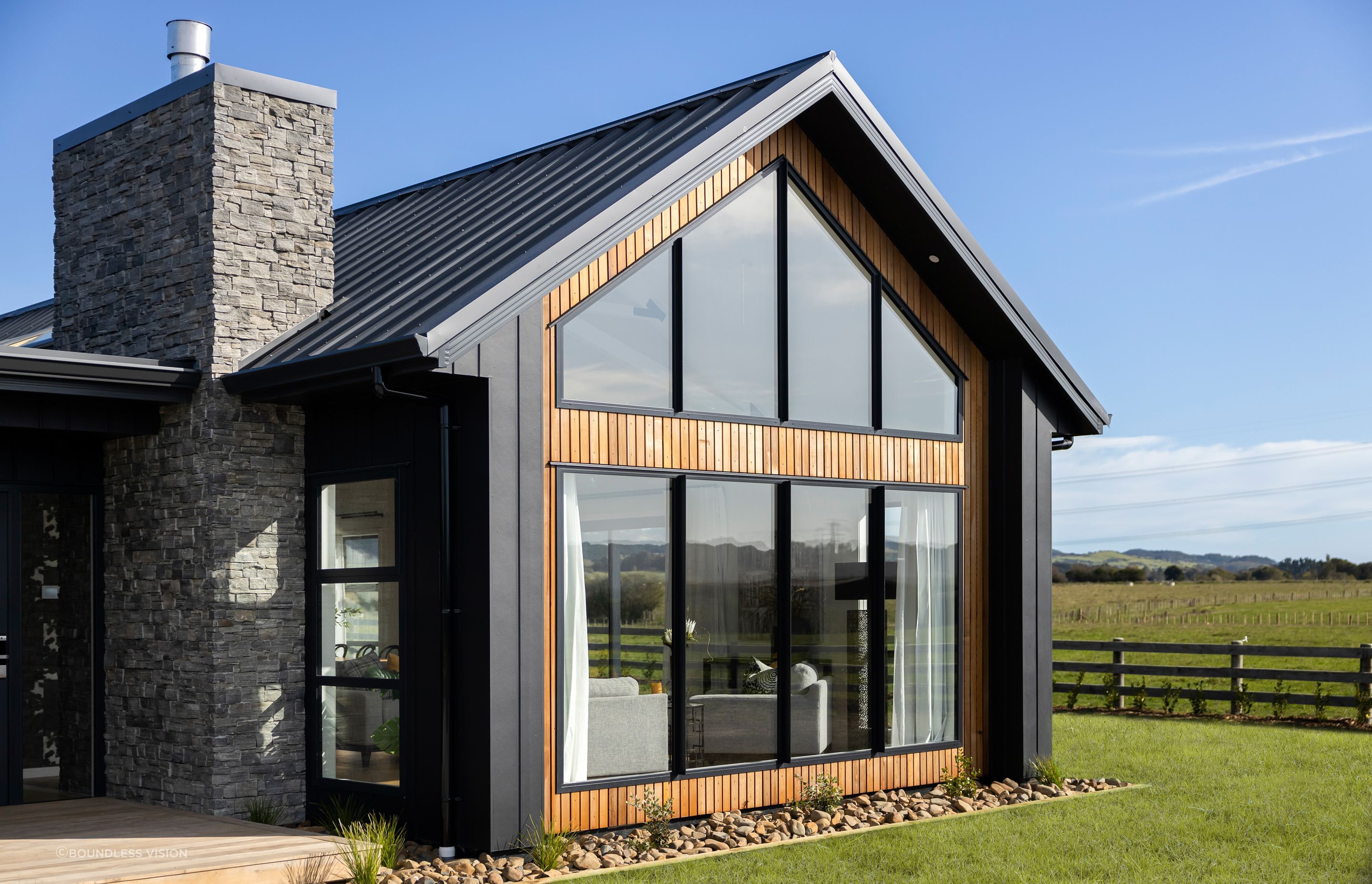 The four-bedroom house is characterised by a traditional, full-sloping gable roof.