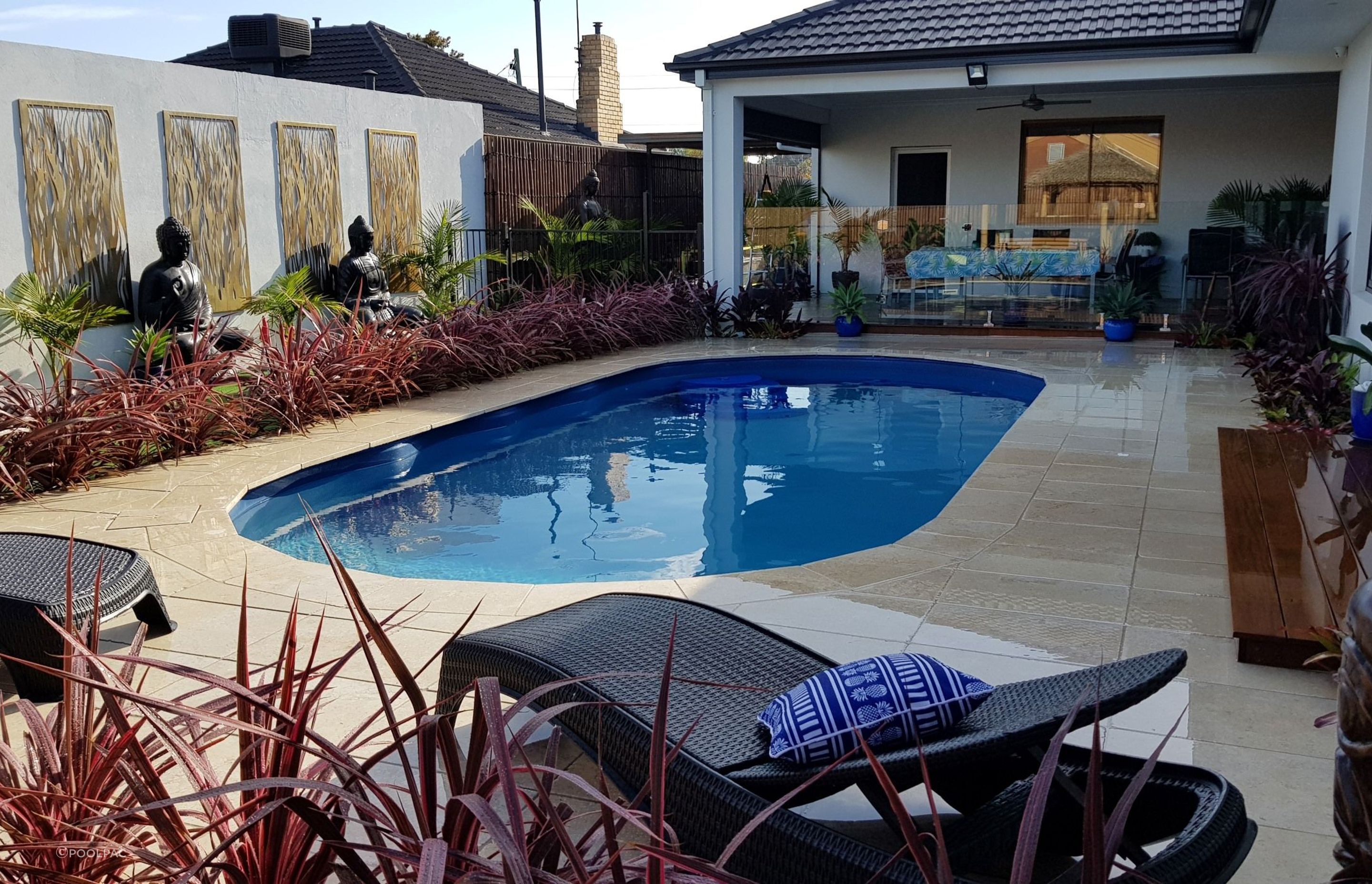 Oval pools, like the Classic Majestic Swimming Pool by Poolpac, enhance the natural feel of an outdoor living space.