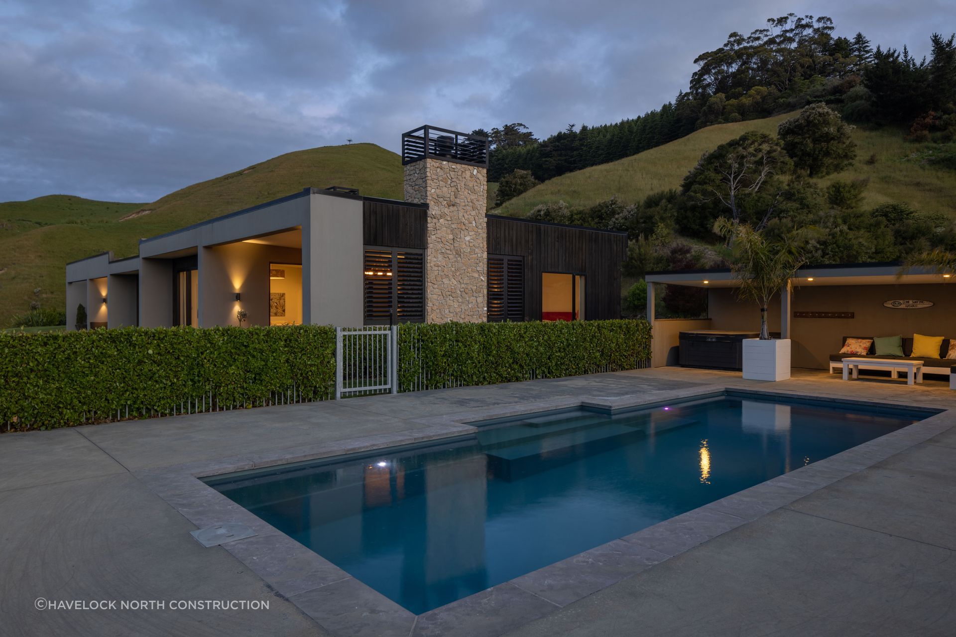 Located up high on Te Mata Peak, this home features vertical shiplap cedar and Celcrete cladding, working harmoniously with Hawke's Bay's golden landscape.