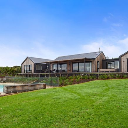 A gable-roofed dream home built on the shores of Northland’s Paewhenua Island