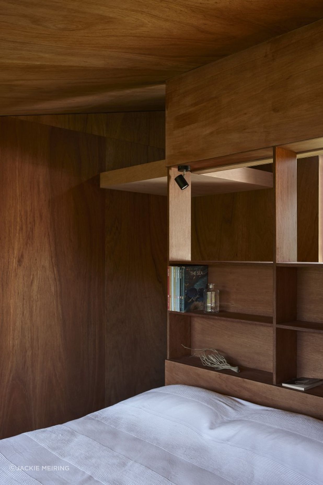 The sleeping pod features built-in shelving.