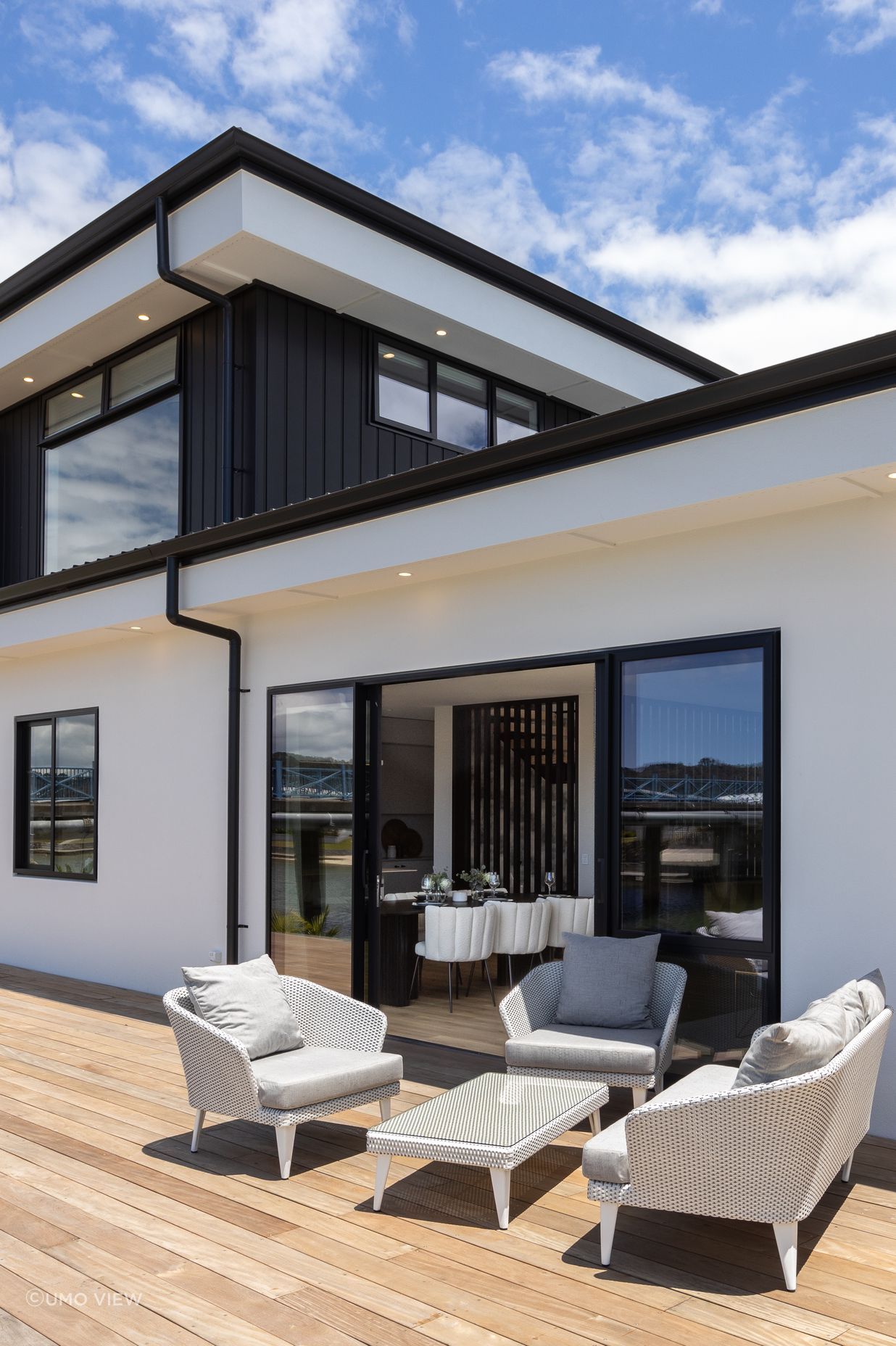 The deck wraps around two sides of the home, offering many spaces for relaxation and entertainment.