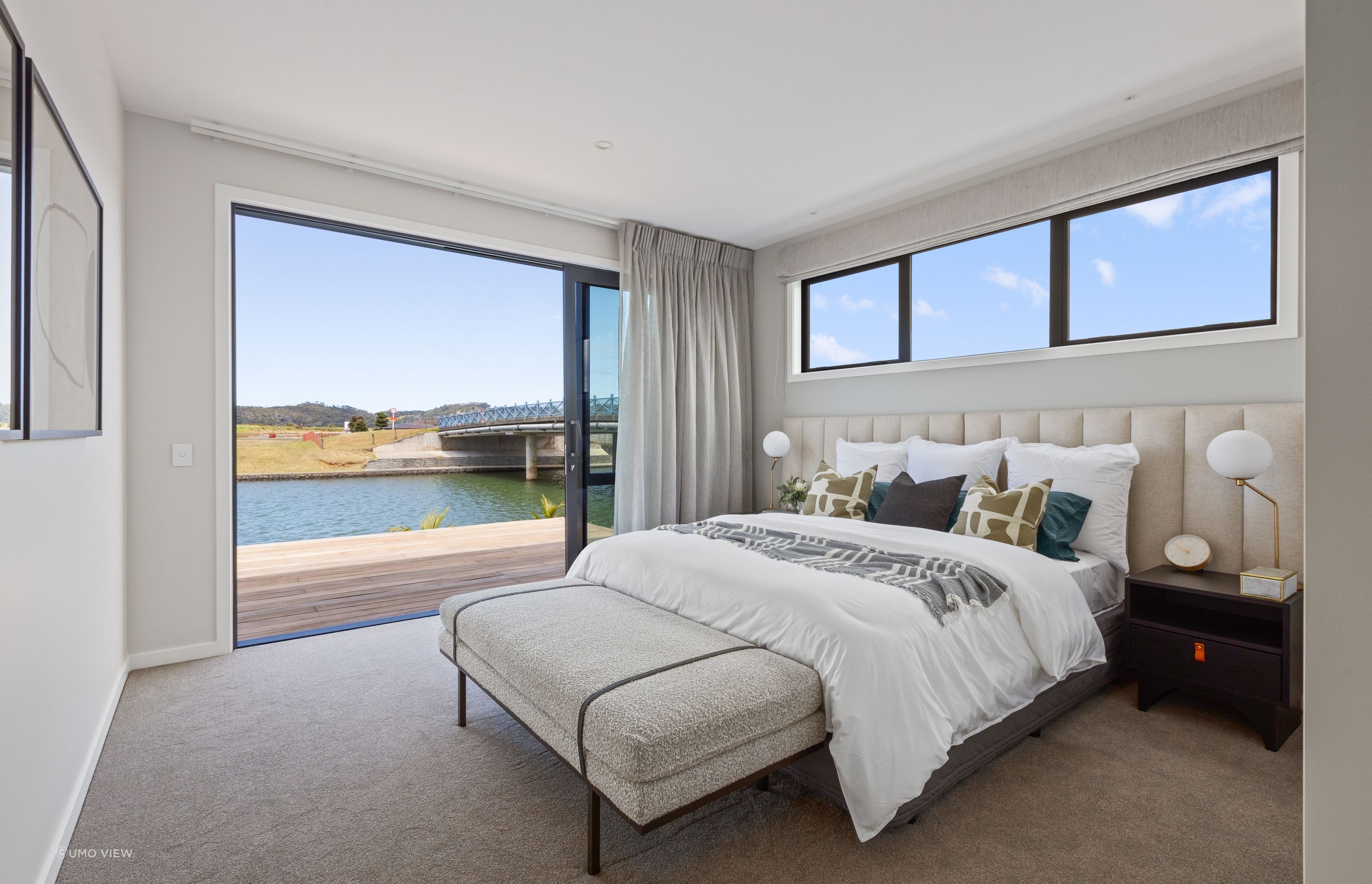 A retreat for relaxation, the master bedroom also enjoys the stunning water view.