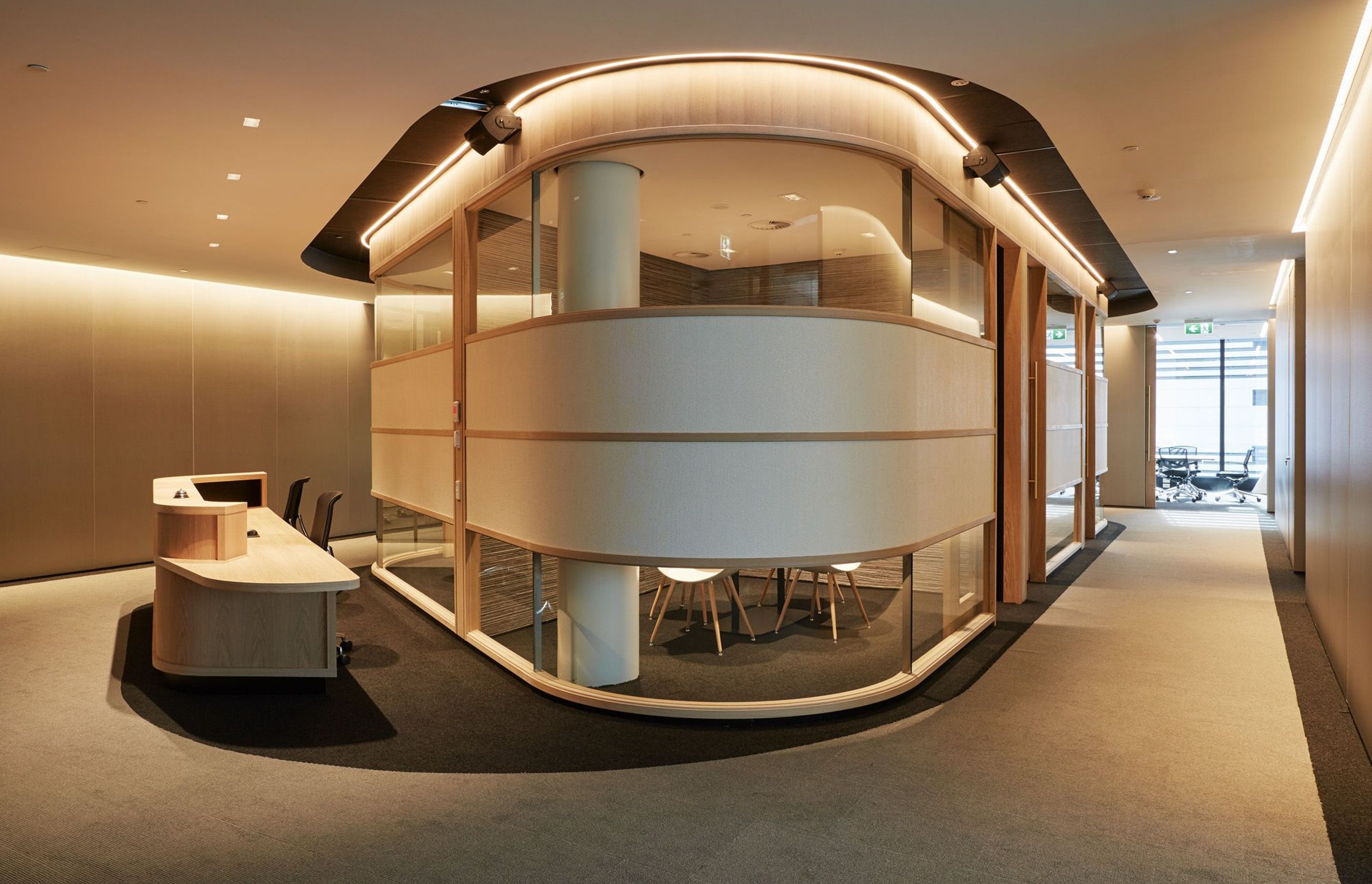Deloitte's reception area on the 12th floor features a curvaceous internal pod that wraps around small meetings rooms,