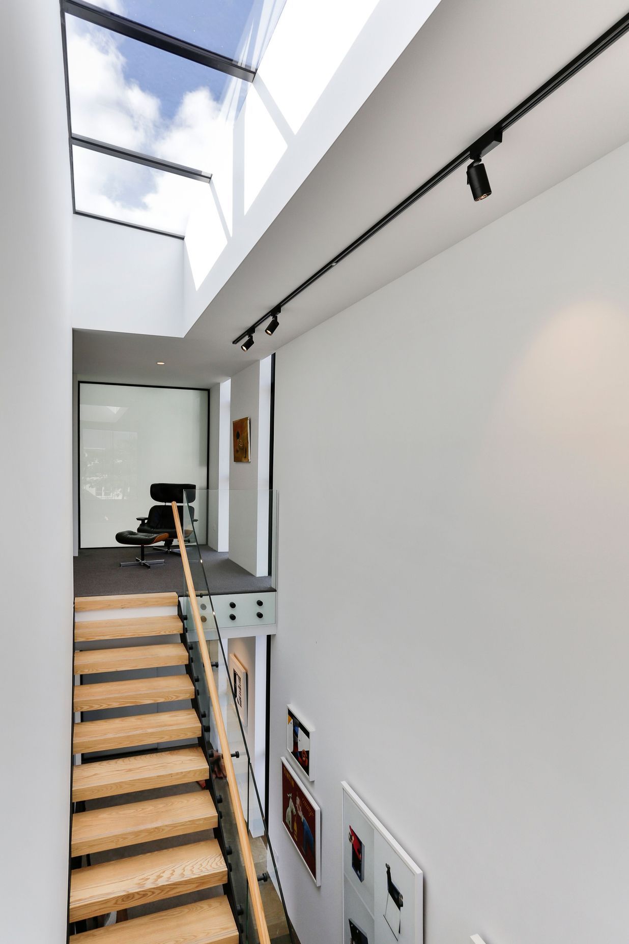 A long skylight pulls light into the entrance and staircase.