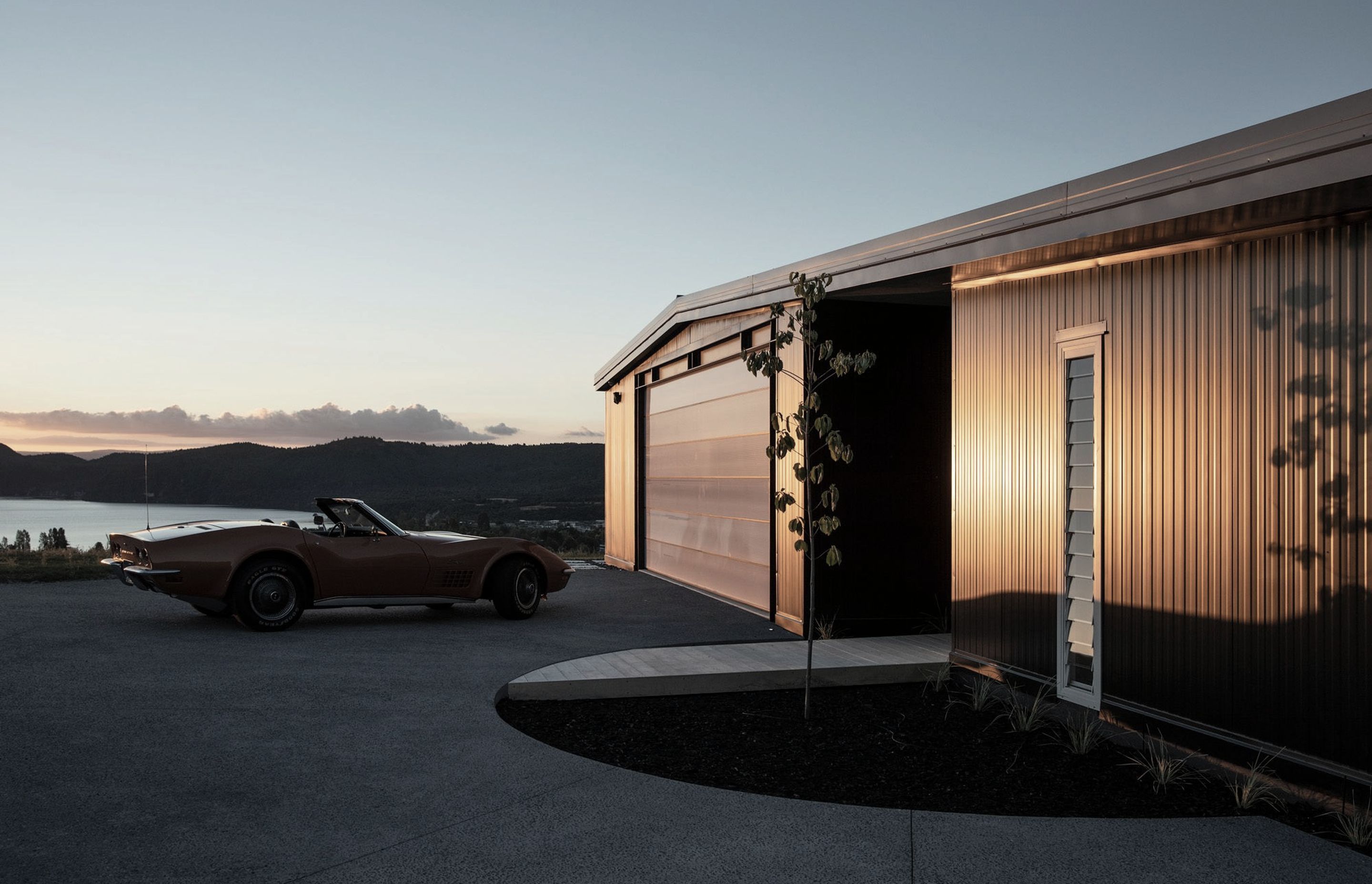 The owners' 1974 Corvette Stingray sits in front of the garage. Photograph: Simon Devitt.