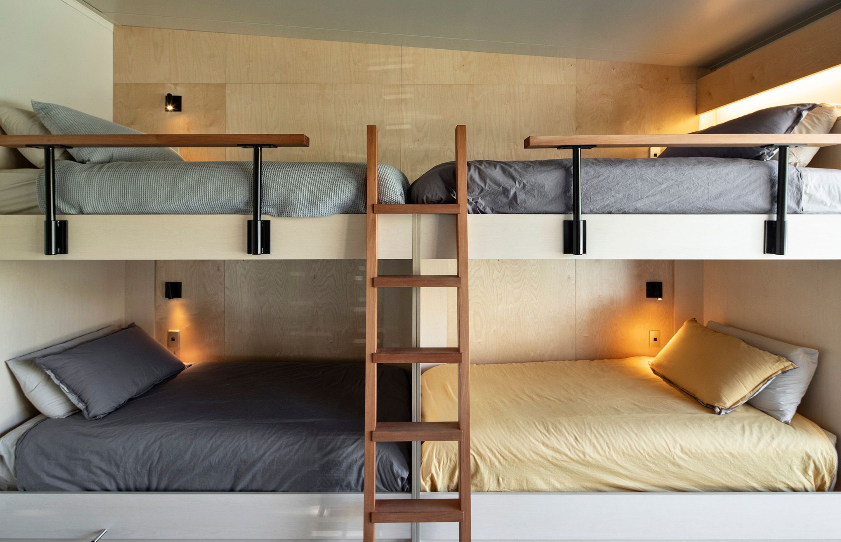Custom designed by the architects, the grandchildrens' bunkroom has four beds on one side and two on the other, providing the ultimate sleepover space. Photograph: Simon Devitt.