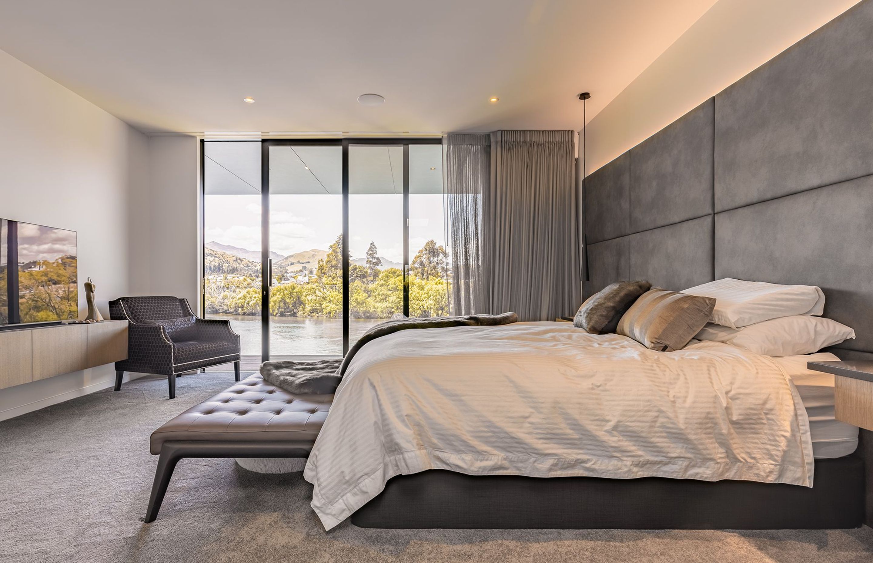 The bedroom enjoys a view right over the lake.