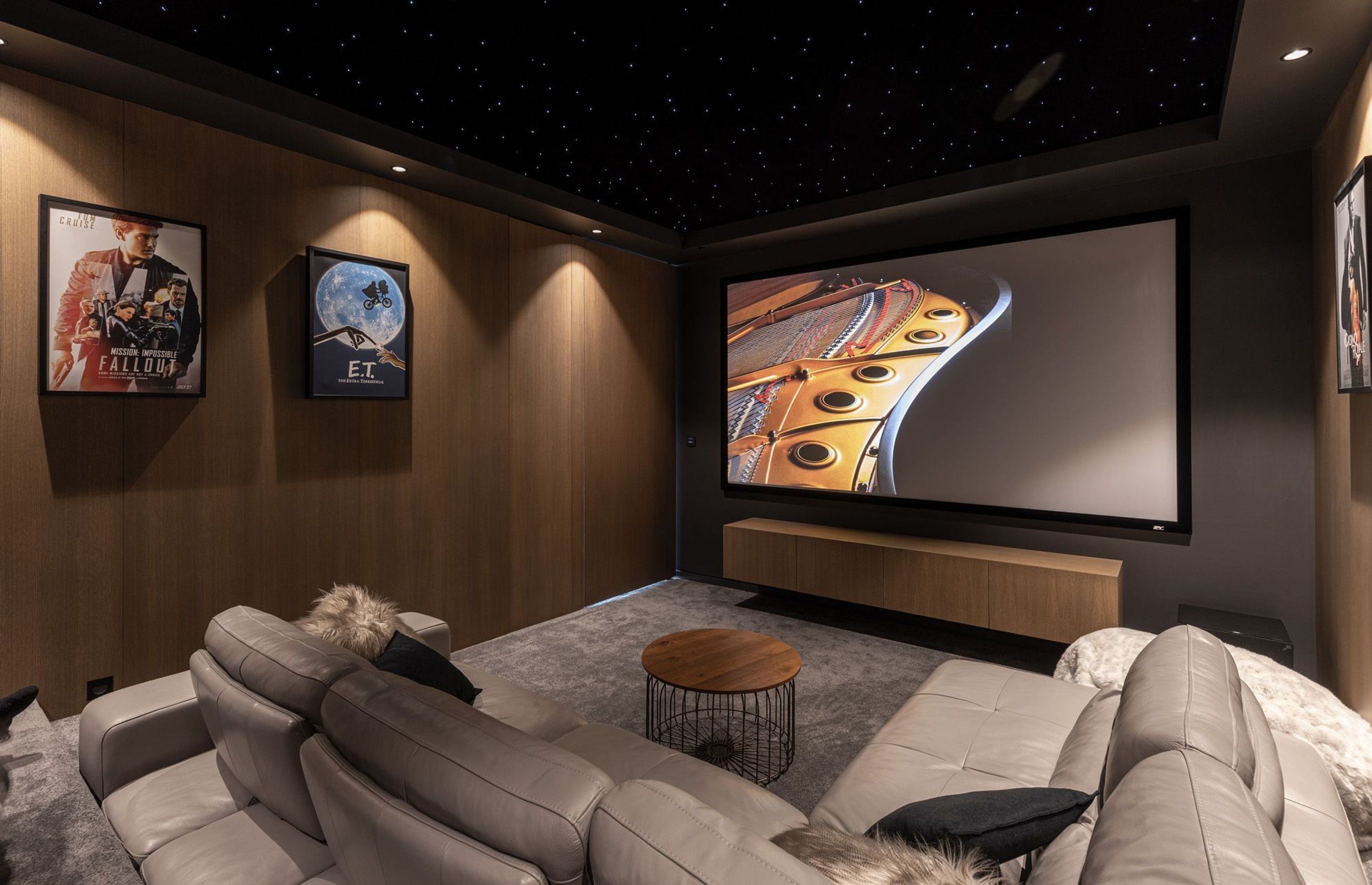 The site is very narrow so space at the back of the living area was perfectly suited to being a darker soundproofed environment for the home cinema, featuring a gorgeous starry ceiling.