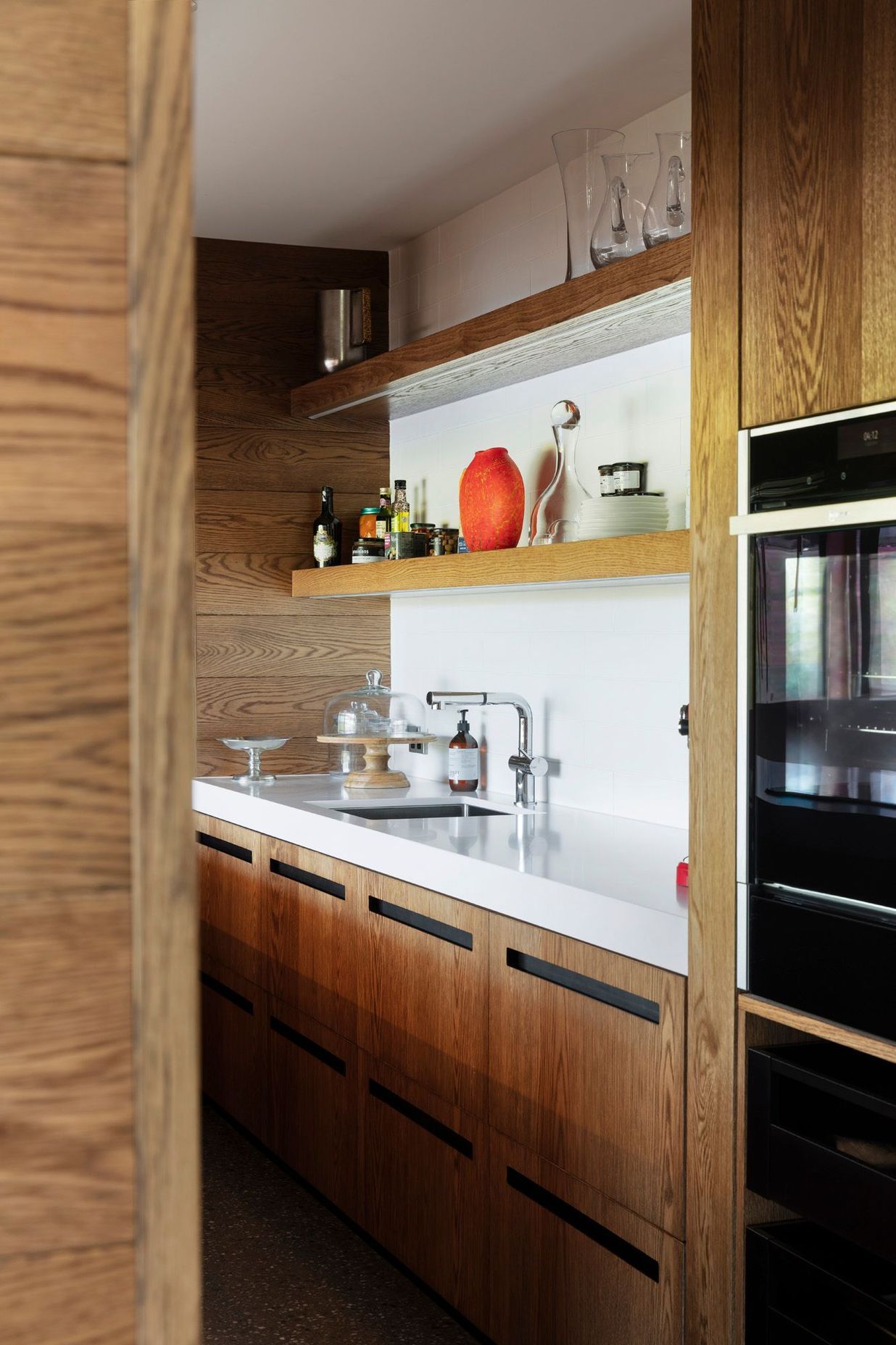 The scullery incorporates high-quality appliances, such as these Neff ovens..