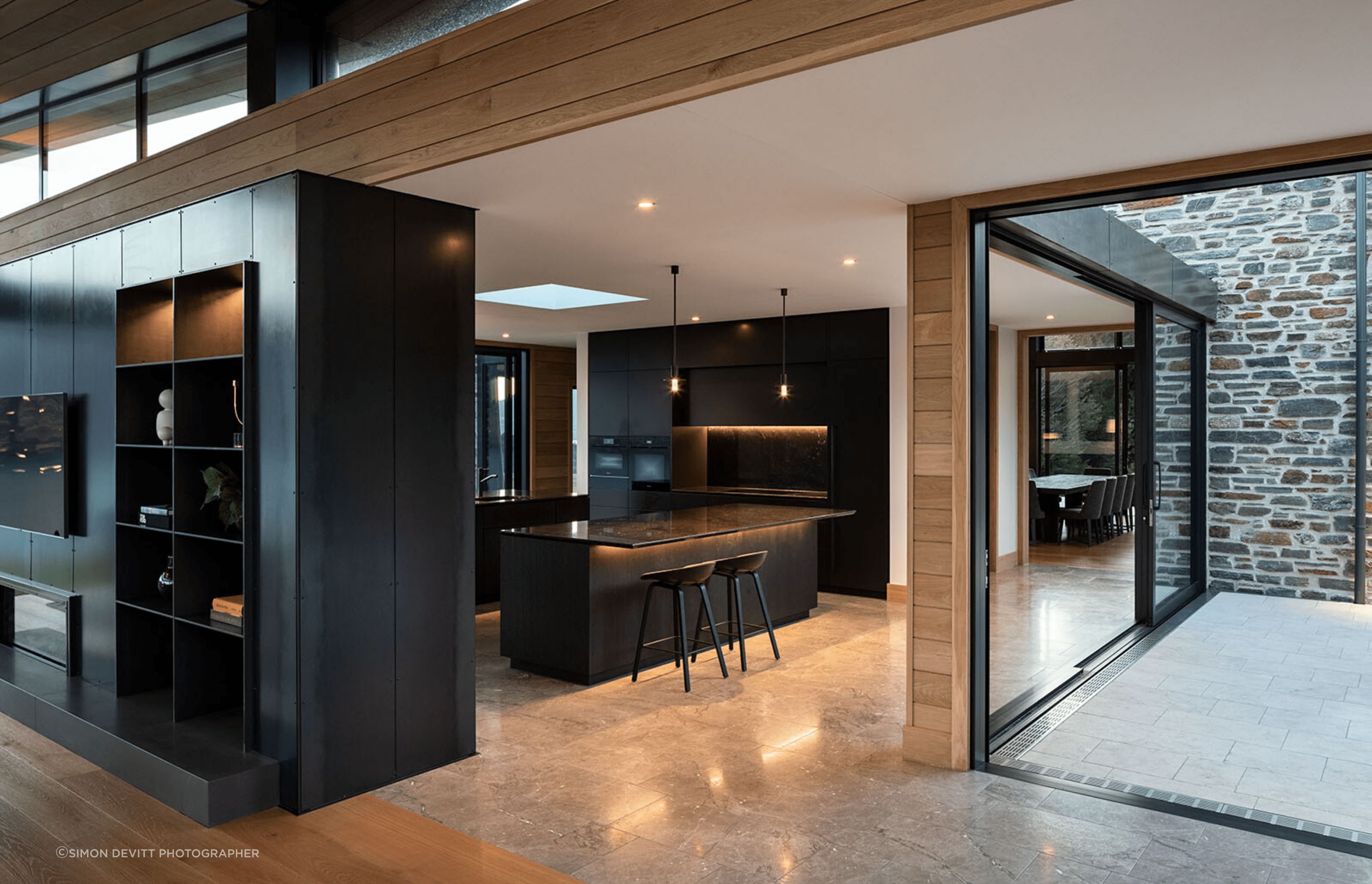 The dark and recessive kitchen means the focus stays on the views and architecture.