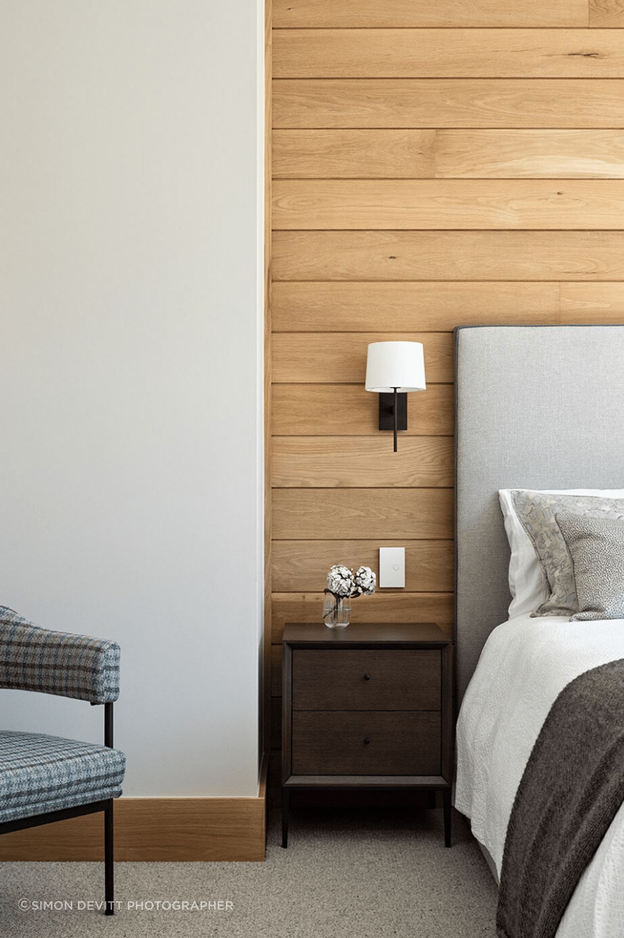Oak timber lining in some of the guest rooms ties the material palette back to the land.