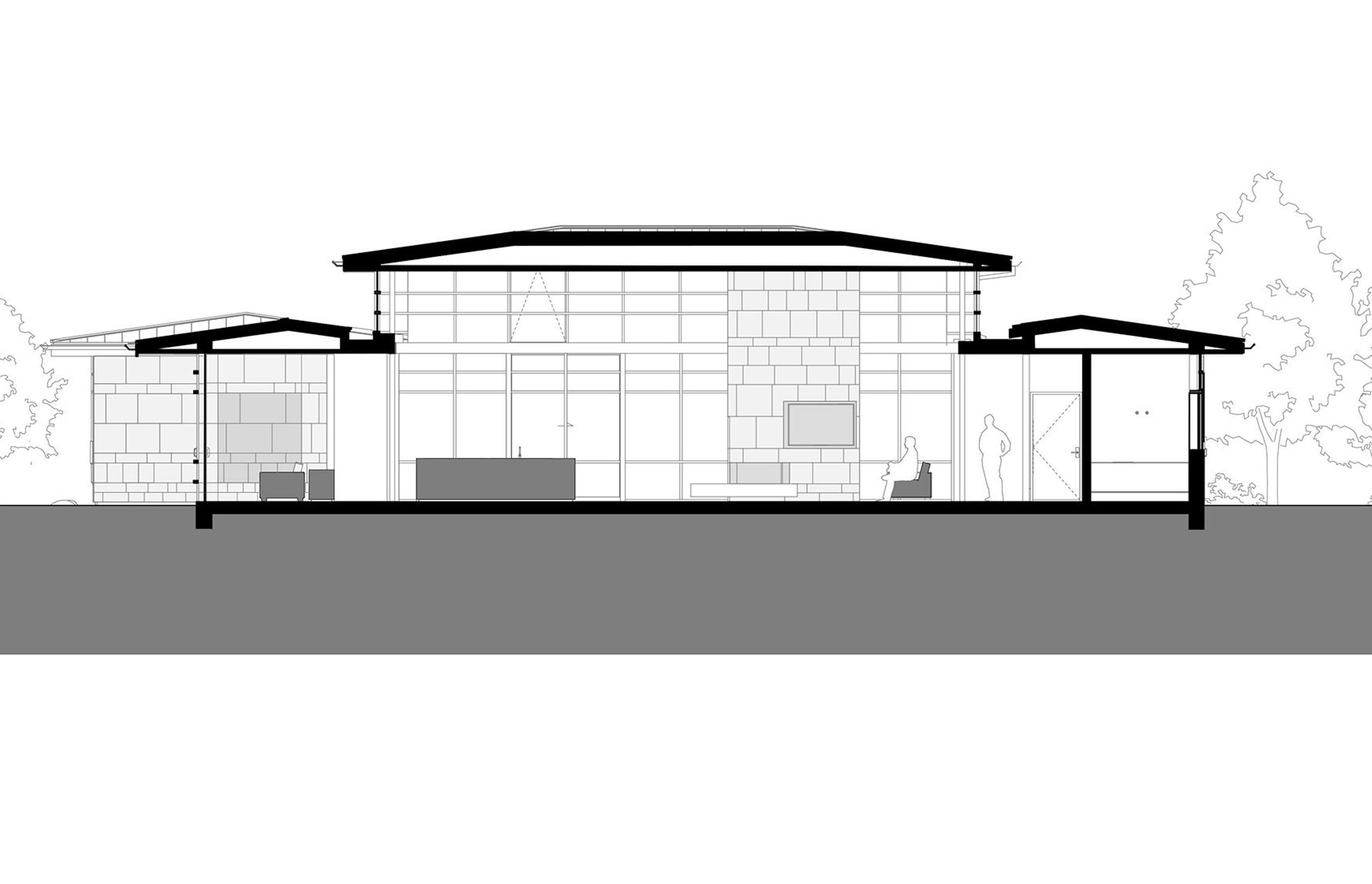 A section or slice-through of the house showing the library and kitchen to the left and the lounge and guest bedroom to the right; by RB Studio.