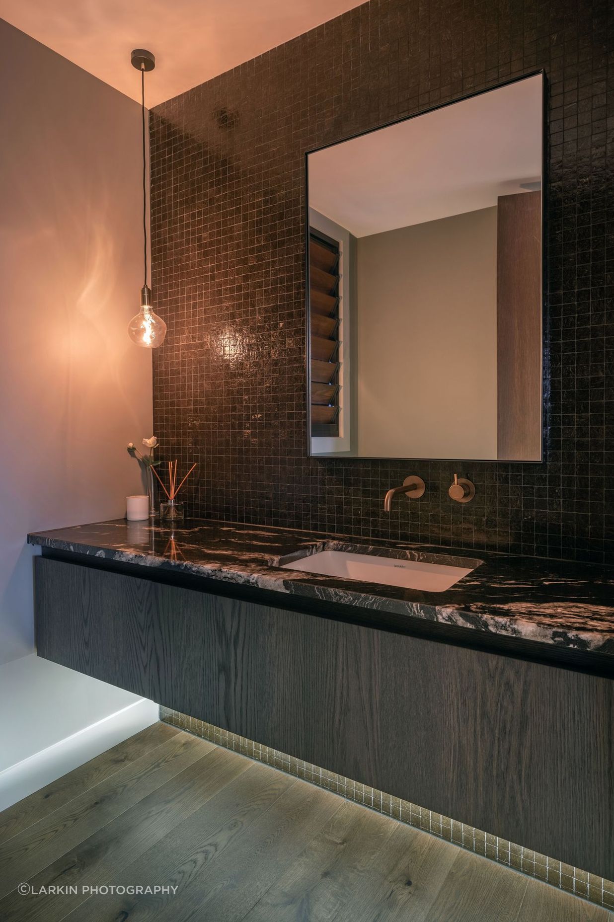 The large guest room's en suite features a dramatic granite countertop.