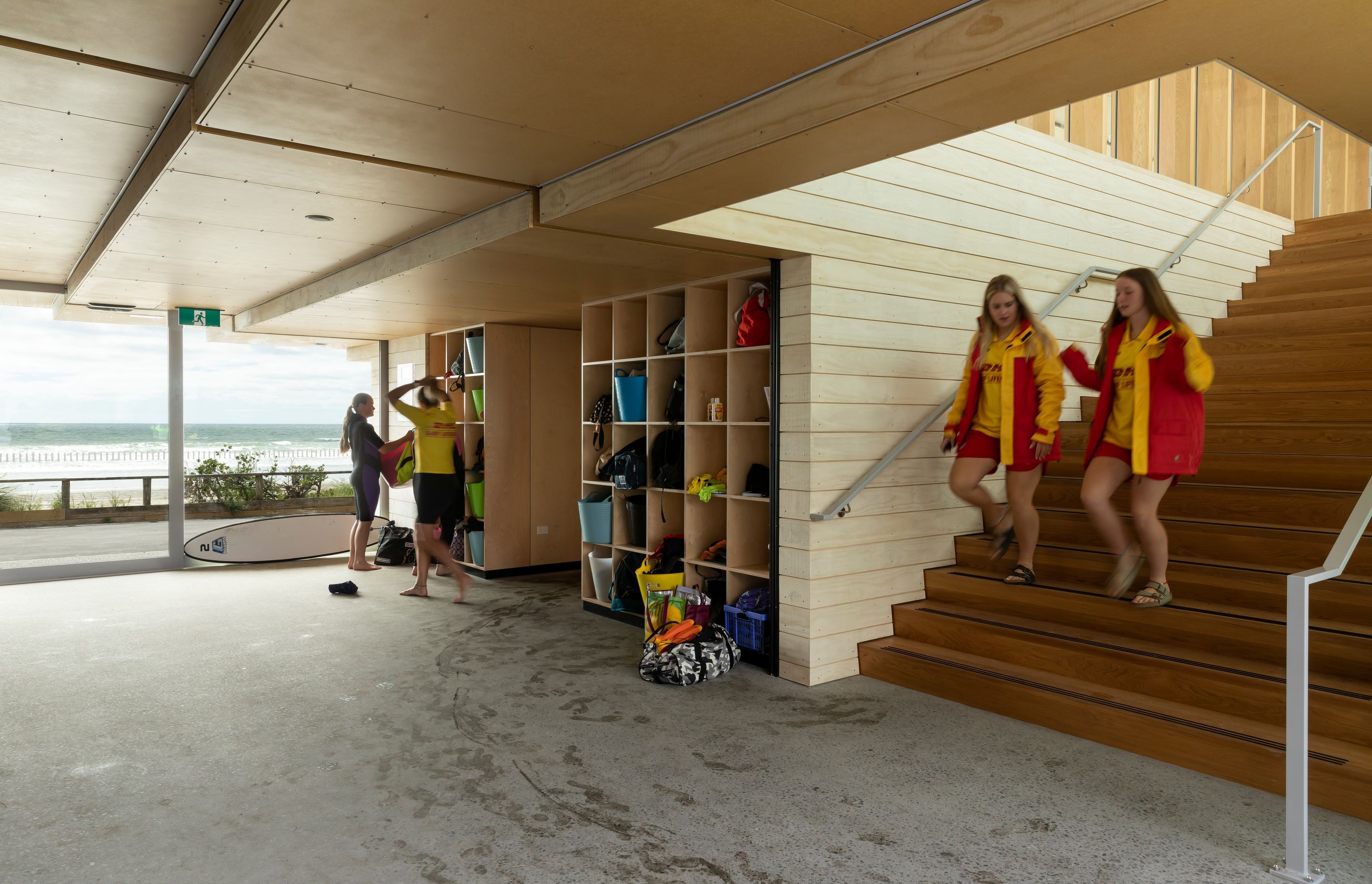 The large glass doors on the seafront provide an entry to the building; the wide foyer and stairs offer a place for groups of lifeguards and trainees to debrief or gather out of the wind and elements.