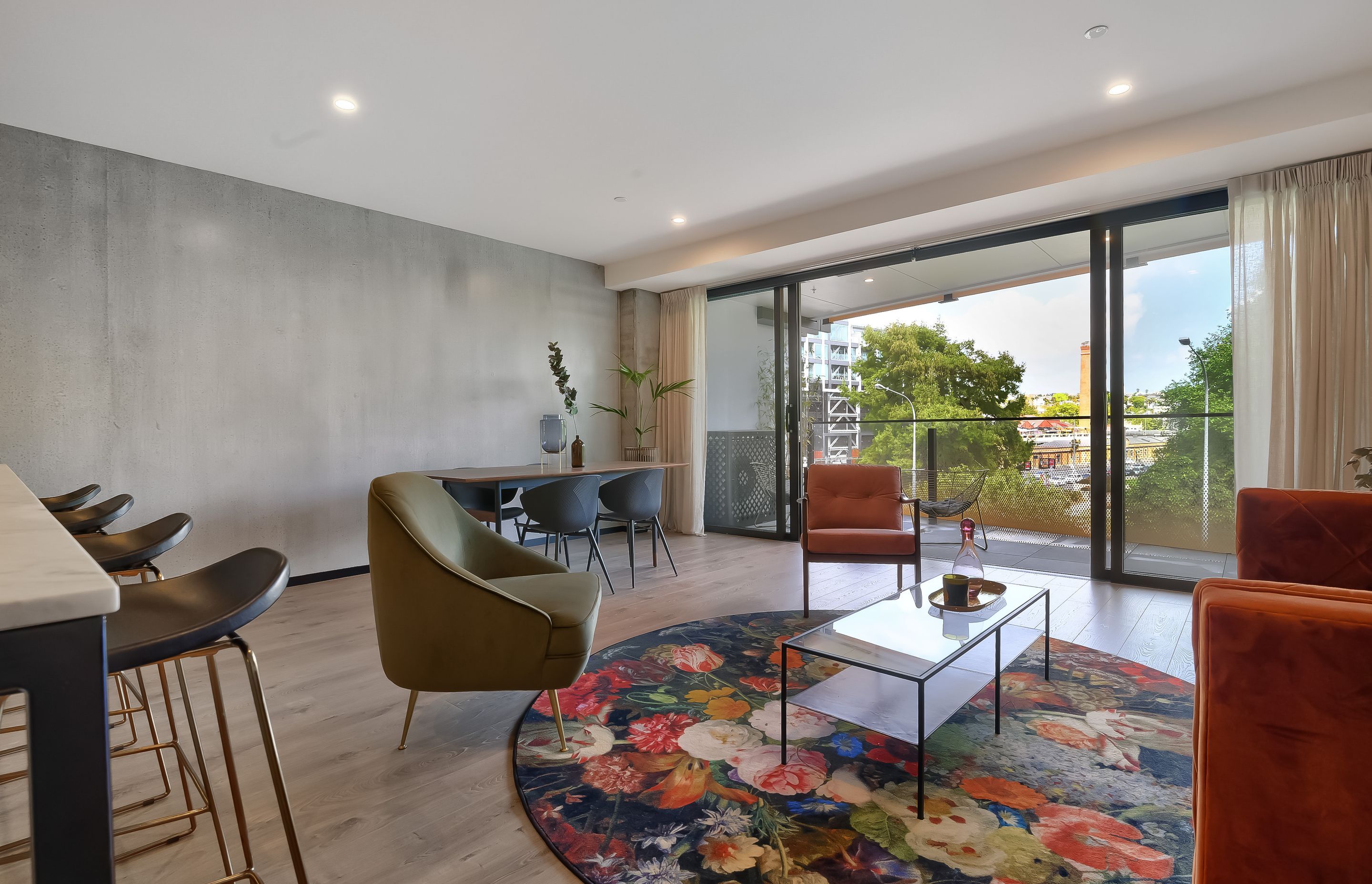 Full-height, full-width glazing is a feature of the park-facing apartments, bringing the outdoors to the fore and complementing the pared back palette.