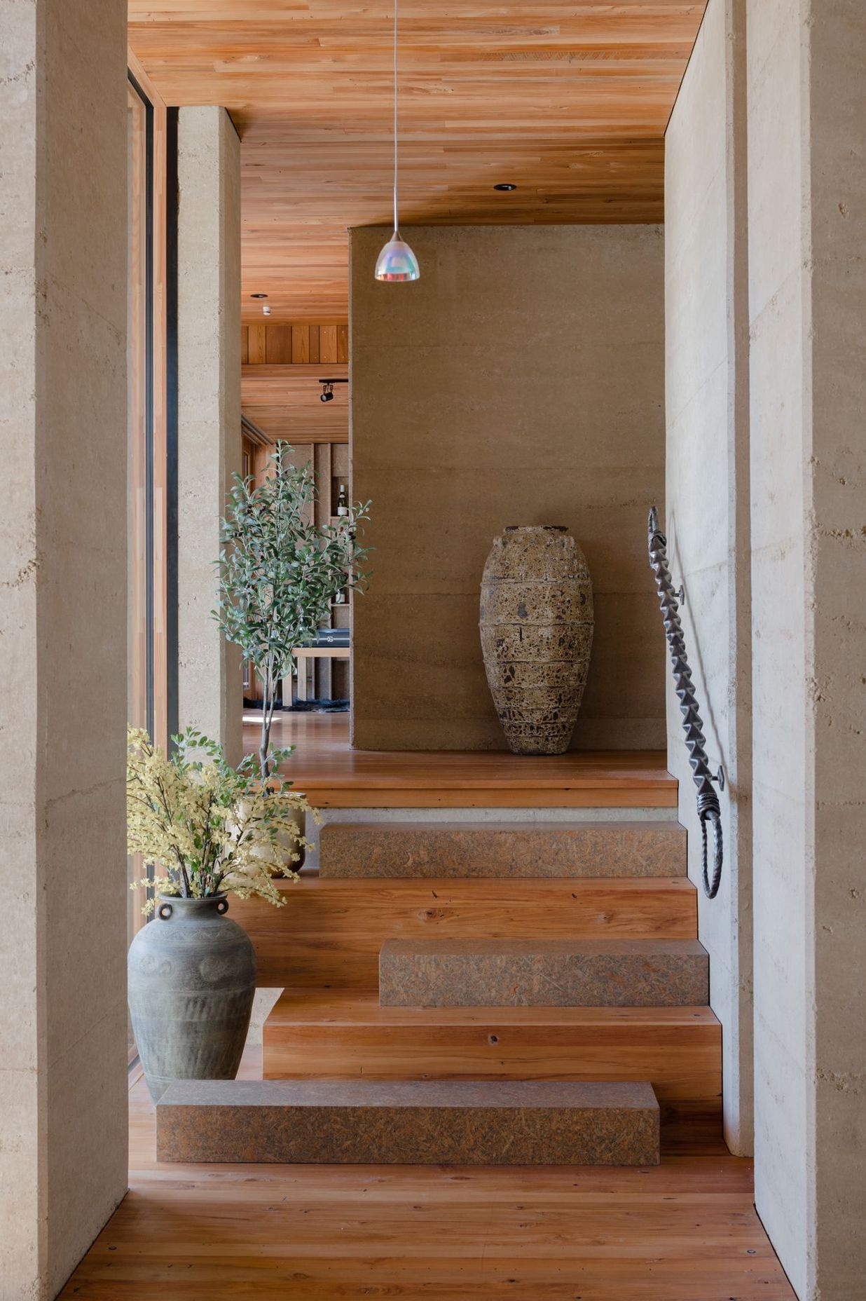 Strand board elements can be found throughout the home, in this instance as every second stair.