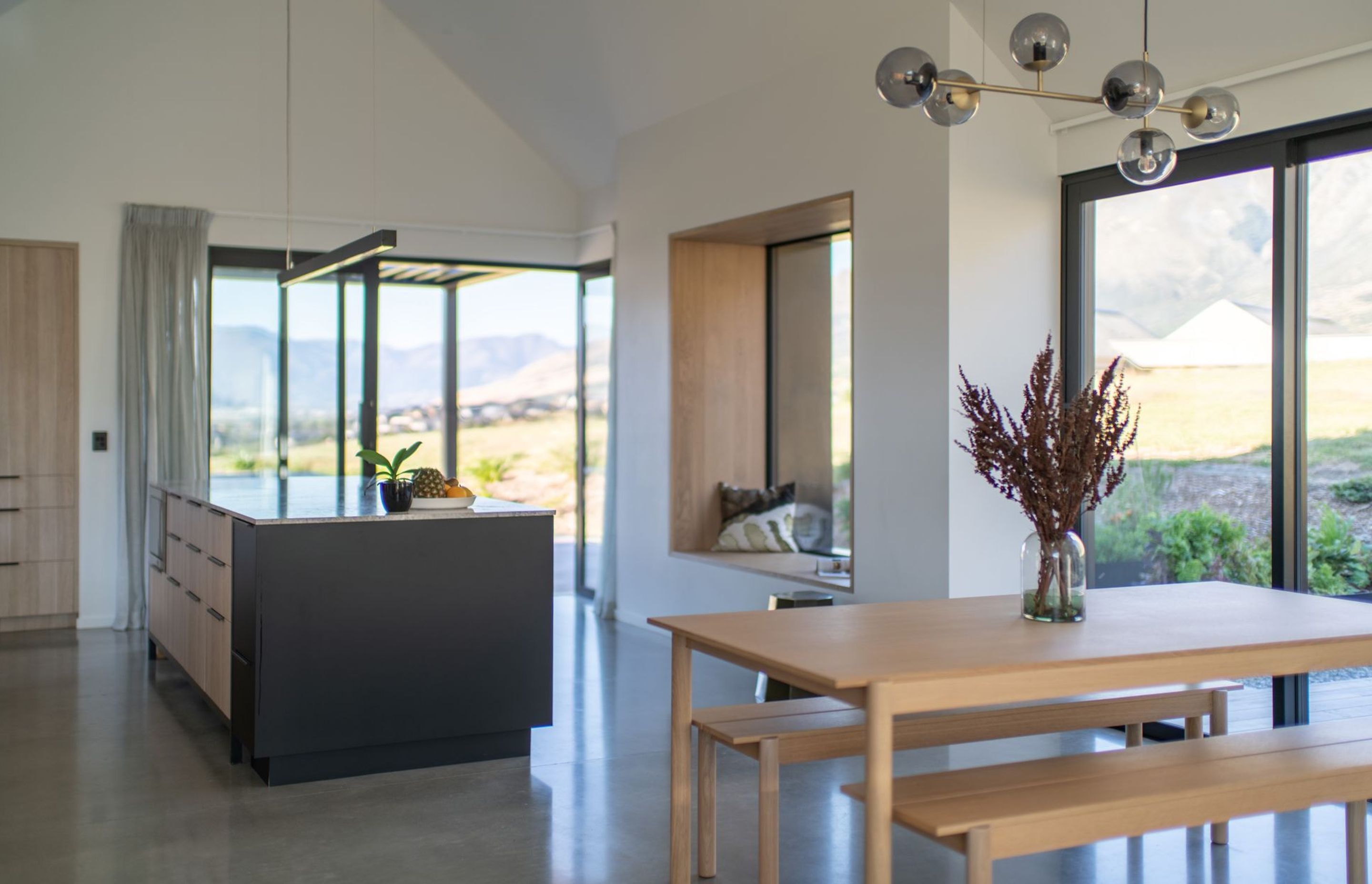 The open-plan kitchen/dining space takes in a huge amount of natural light through extensive glazing.